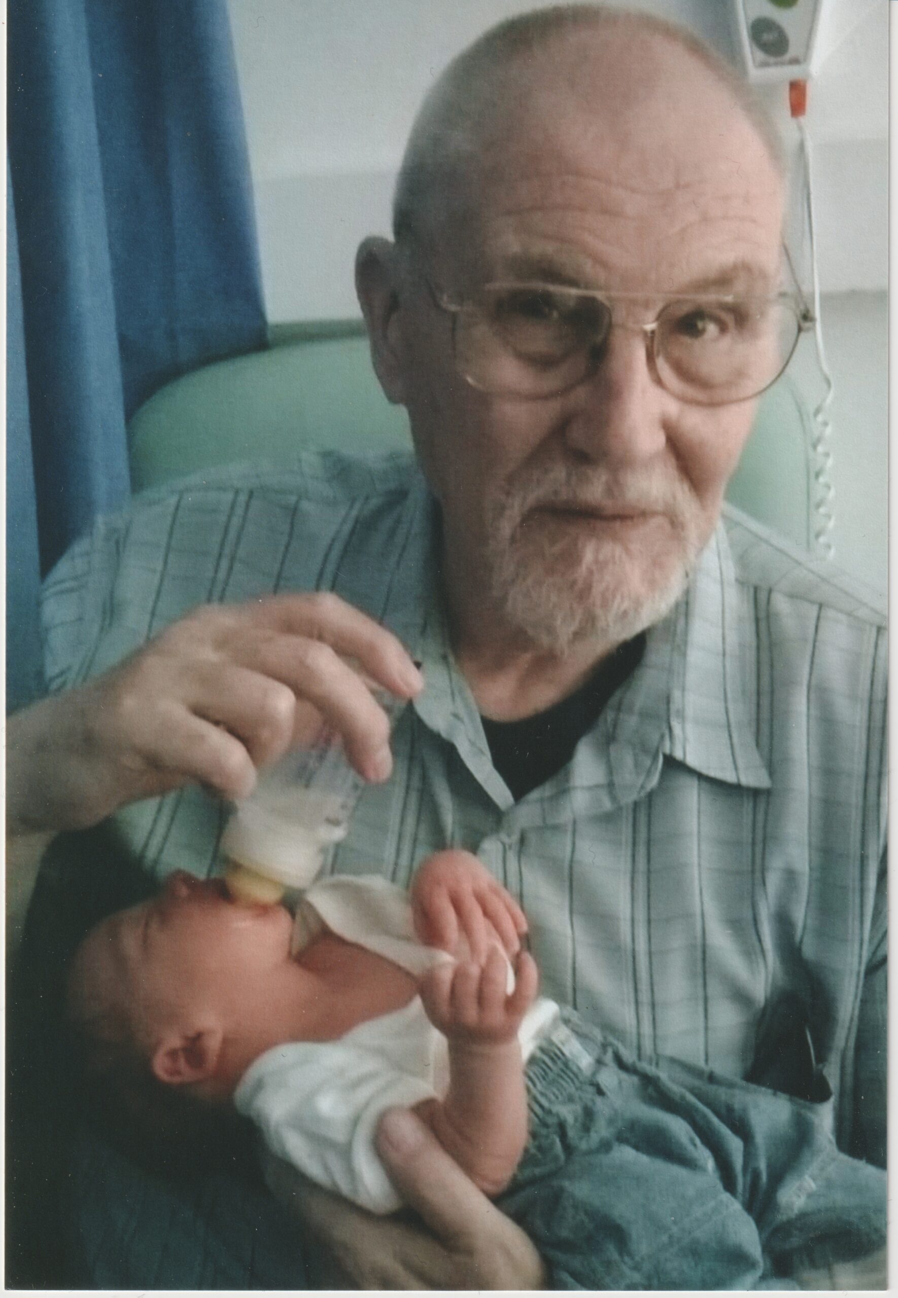 John holding baby Nathaniel, 2016